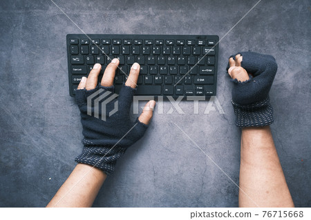 hacker hand stealing data from laptop top down hacker hand stealing data from laptop top down 76715668