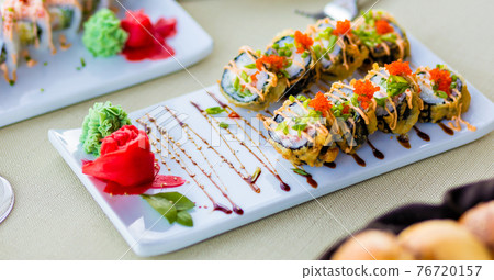 Colorful sushi roll with salmon. Japanese food Colorful sushi roll with salmon. Japanese food 76720157