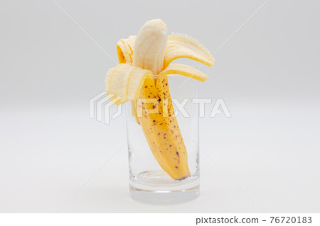 Banana juice image Peeled banana is in a glass 76720183