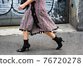 Detail of a fashionable outfit woman wearing colorful dress and high heel shoes 76720278