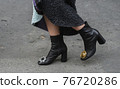 Detail of a fashionable outfit woman wearing black shoes 76720286