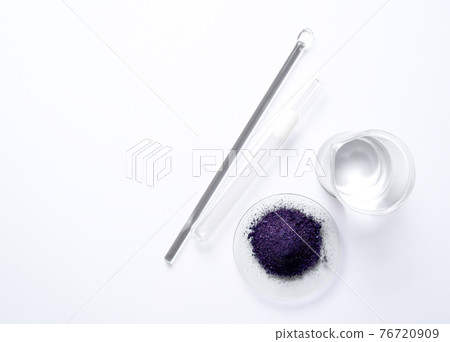 Cosmetic chemicals ingredient on white laboratory table. Potassium permanganate (KMnO4), Alcohol, stirring rod and test tube. Top view Cosmetic chemicals ingredient on white laboratory table. Potassium permanganate (KMnO4), Alcohol, stirring rod and test tube. Top view 76720909