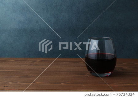 Red wine table poured into a glass 76724324