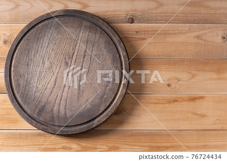 Meat or bread pizza cutting board for homemade baking on table. Wooden pizza board 76724434