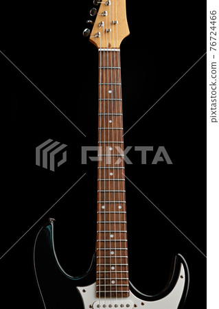 Electric guitar isolated on black background Electric guitar isolated on black background 76724466