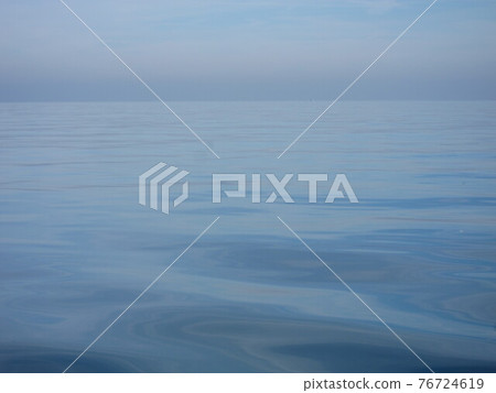 Sea in background with small ripples Sea in background with small ripples 76724619