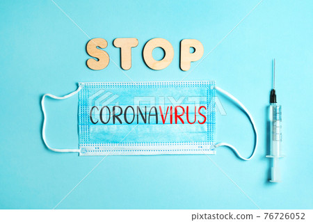 Words STOP CORONAVIRUS from wooden letters and letters on facemask and syringe. Vaccination and the end of epidemic concept. Words STOP CORONAVIRUS from wooden letters and letters on facemask and syringe. Vaccination and the end of epidemic concept. 76726052