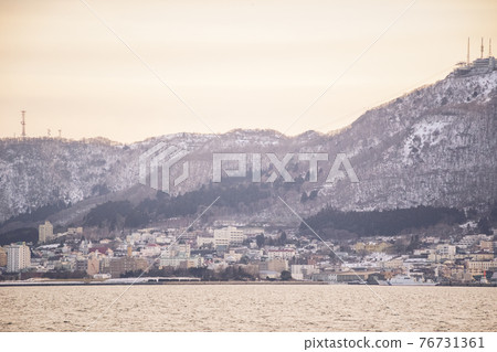 Mount Hakodate and its cityscape at dusk at West Wharf, Hakodate City Mount Hakodate and its cityscape at dusk at West Wharf, Hakodate City 76731361