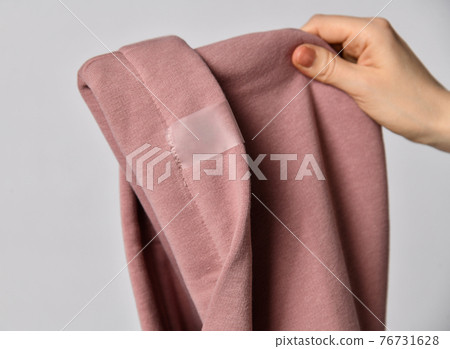 Closeup of pink hood with curved edge, cowl top 76731628