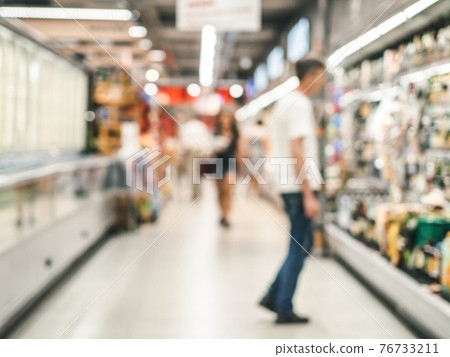 blurred supermarket aisle 76733211