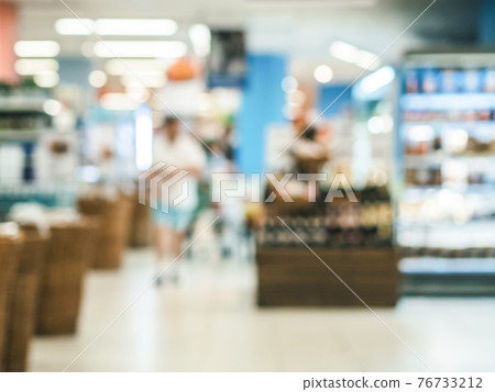 Blurred colorful supermarket products on shelves 76733212