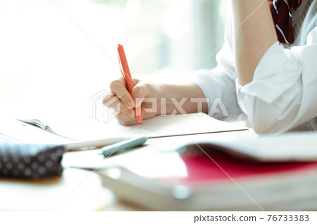 Hands of female students studying 76733383