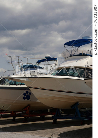 Boat cruiser on the marina hill 76733907