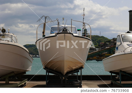 Boat cruiser on the marina hill 76733908