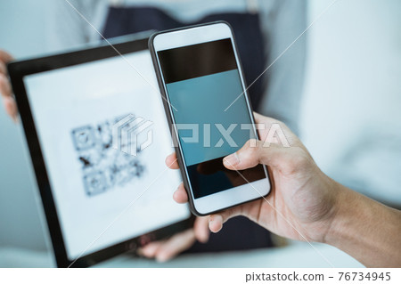 close up shopkeeper serve customer qris barcode close up shopkeeper serve customer qris barcode 76734945