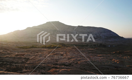 Dawn over frozen lava and mountains. 76736667