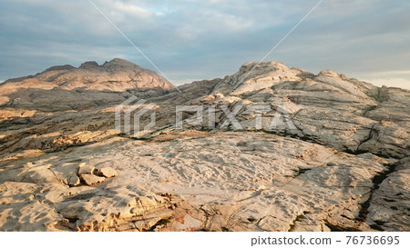 Dawn over frozen lava and mountains. Dawn over frozen lava and mountains. 76736695