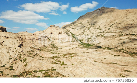 Huge rocks from lava. A former volcano. Huge rocks from lava. A former volcano. 76736820