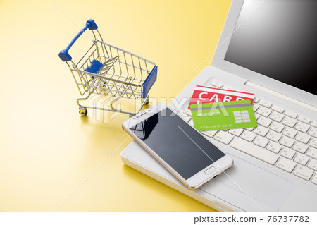 Image of PC and shopping cart online shopping 76737782
