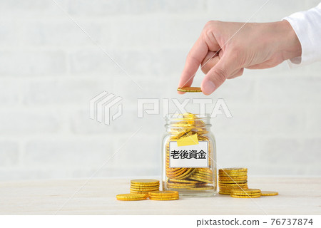 Hands of a person who saves old age assets 76737874