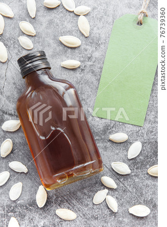 Bottle with pumpkin seed oil 76739360