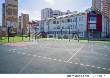 Basketball and play area near the new school 76740140