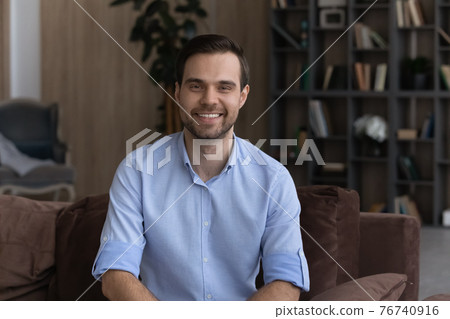 Portrait of happy man talk on video call 76740916