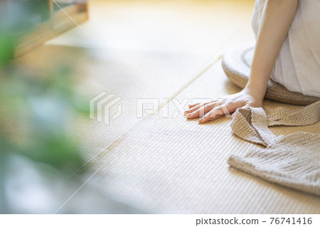A girl sitting in a Japanese-style room with tatami mats [Summer] 76741416
