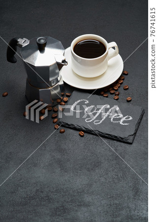 Coffee handwritten inscription sign on chalk board and cup of espresso coffee 76741615