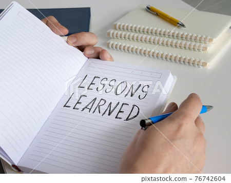Lessons learned concept. The man made a diary entry. Lessons learned concept. The man made a diary entry. 76742604