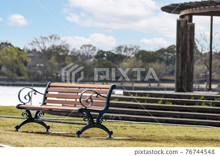 Antique bench in the morning sun 76744548