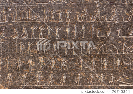 Mysterious drawing on the dark grey tomb wall. 76745244