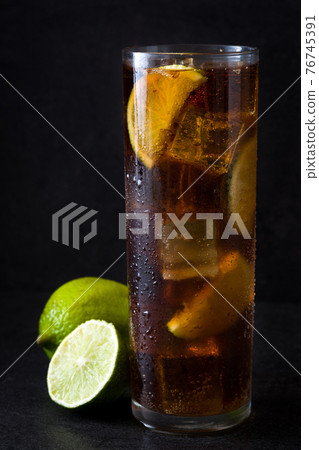 Cuba libre. Cocktail with rum, lime and ice Cuba libre. Cocktail with rum, lime and ice 76745391