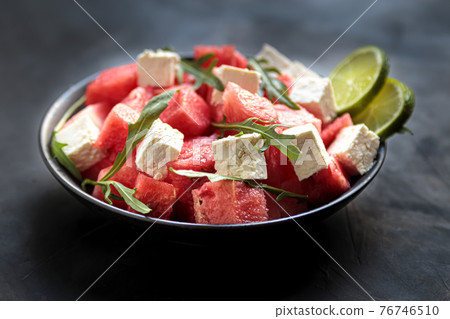 Watermelon salad with feta cheese, arugula, lime Watermelon salad with feta cheese, arugula, lime 76746510