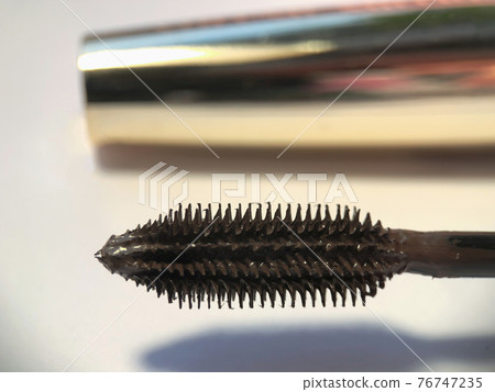 Close-up of mascara brush on white background.  Beauty concept. 76747235