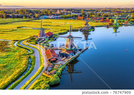 Zaanse Schans windmills in North Holland, Netherlands 76747909