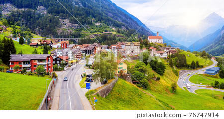 Wassen village in a swiss Alps valley, Switzerland 76747914
