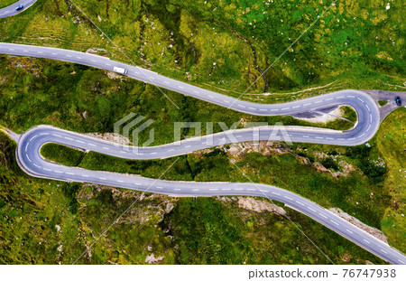 Oberalp pass serpentine mountain road in swiss Alps, Switzerland Oberalp pass serpentine mountain road in swiss Alps, Switzerland 76747938