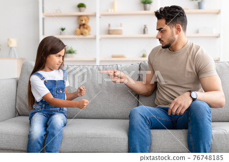 Family Conflict. Angry black father scolding sad daughter Family Conflict. Angry black father scolding sad daughter 76748185