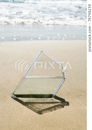 Reusable water bottle on the beach Stock Photo by ©nito103 279147558