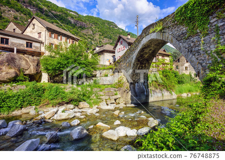 Roman bridge in Giornico village, Switzerland Roman bridge in Giornico village, Switzerland 76748875