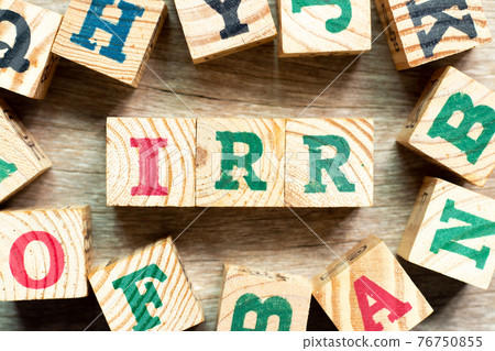 Alphabet letter block in word IRR (Abbreviation of internal rate of return) with another on wood background Alphabet letter block in word IRR (Abbreviation of internal rate of return) with another on wood background 76750855