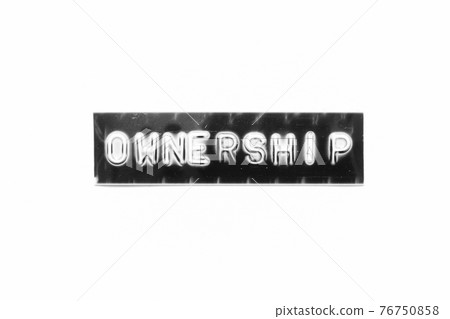 Embossed letter with word ownership in black banner on white paper background Embossed letter with word ownership in black banner on white paper background 76750858