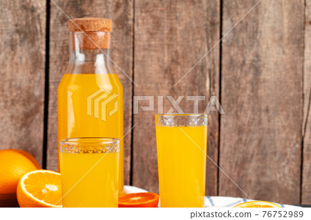 Orange juice cup on table close up Orange juice cup on table close up 76752989