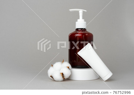 Stack of cotton discs and skicare cosmetic bottle Stack of cotton discs and skicare cosmetic bottle 76752996