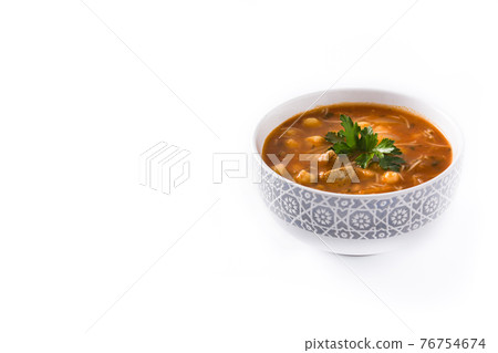 Harira soup in bowl isolated on white background 76754674