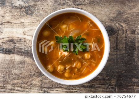 Harira soup in bowl on wooden table 76754677