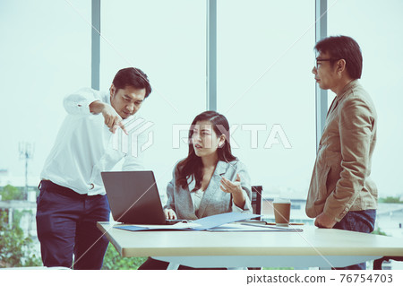 Manager point mistake present in laptop Managing Director and secretary in meeting room Manager point mistake present in laptop Managing Director and secretary in meeting room 76754703
