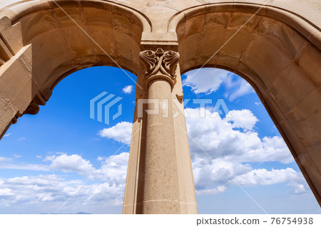View from the arches to the beautiful blue sky with white clouds 76754938