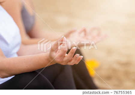 Close up of female in a meditation pose Close up of female in a meditation pose 76755365